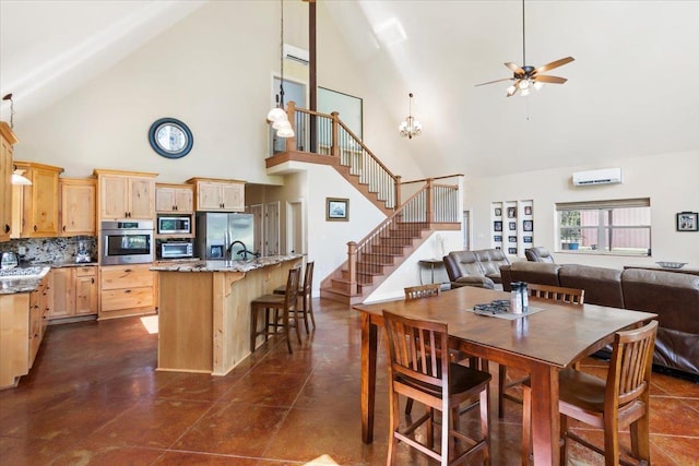 dining area featuring a wall mounted air conditioner, ceiling fan, and high vaulted ceiling