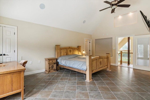 bedroom with ceiling fan and high vaulted ceiling