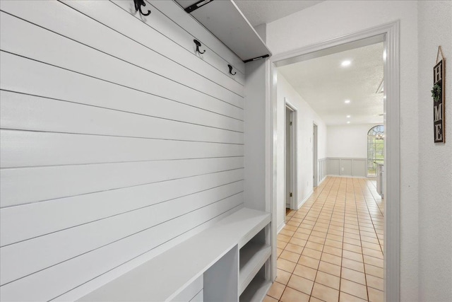 6635 Griffing Rd, Beaumont, TX 77708 - mudroom featuring light tile patterned flooring, recessed lighting, and wainscoting