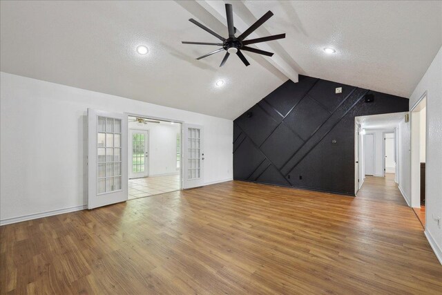 6635 Griffing Rd, Beaumont, TX 77708 - unfurnished living room featuring vaulted ceiling with beams, a textured ceiling, light wood-style flooring, baseboards, and ceiling fan