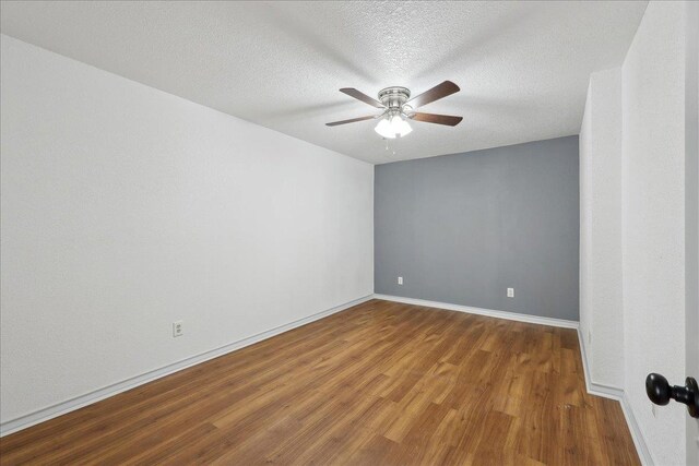 6635 Griffing Rd, Beaumont, TX 77708 - spare room with baseboards, a textured ceiling, wood finished floors, and a ceiling fan