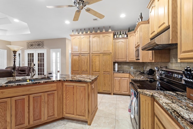 kitchen with dark stone counters, french doors, electric range, ceiling fan, and light tile patterned flooring