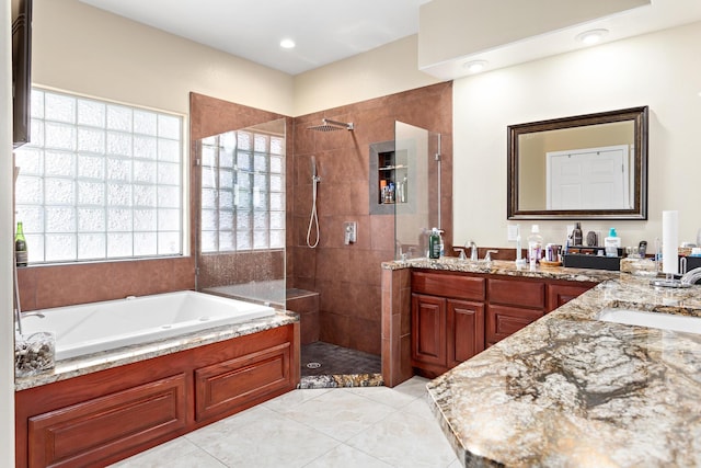 bathroom featuring separate shower and tub, tile patterned floors, and vanity