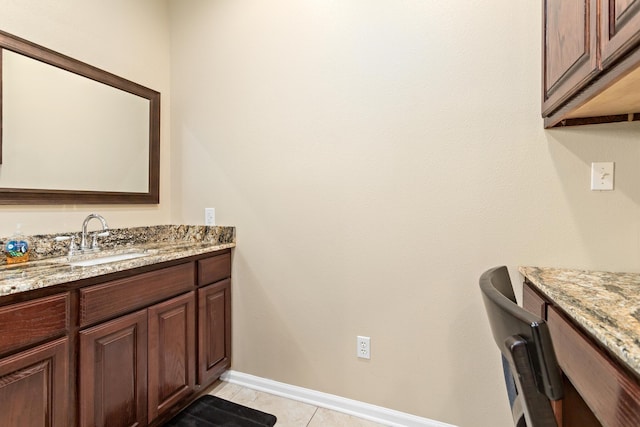 bathroom featuring tile patterned flooring and vanity