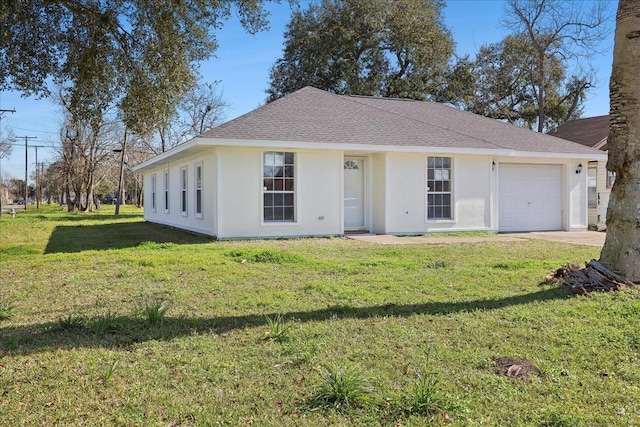 single story home with a front lawn, an attached garage, a shingled roof, and stucco siding