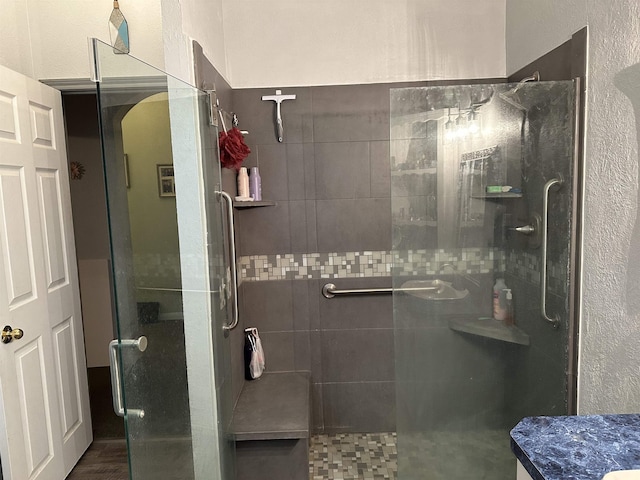 304 County Road 773, Buna, TX 77612 - bathroom featuring tiled shower, a textured wall, and vanity