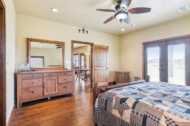 bedroom with access to exterior, ceiling fan, french doors, and dark wood-type flooring