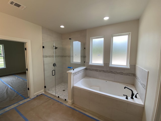 bathroom featuring plus walk in shower