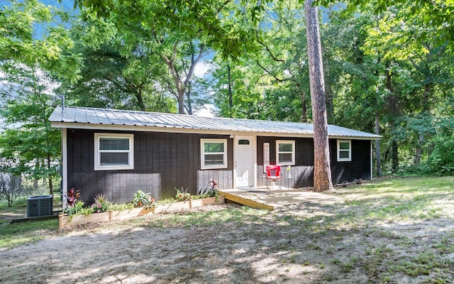 ranch-style home with central air condition unit