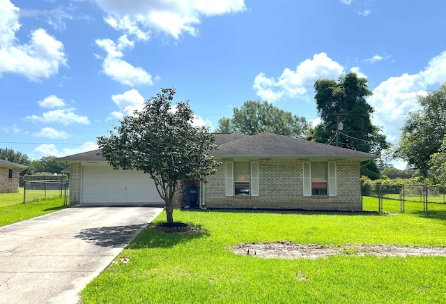 109 Carriage Ln, Silsbee, TX 77656 - single story home with brick siding, a garage, and concrete driveway