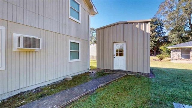 exterior space with a yard and a shed