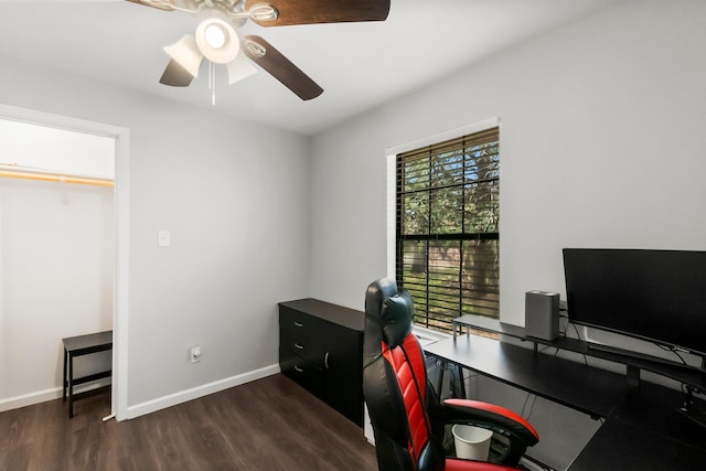 office space featuring baseboards, a ceiling fan, and wood finished floors