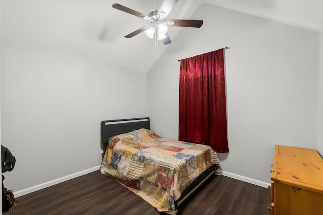 bedroom with baseboards, lofted ceiling, wood finished floors, and a ceiling fan