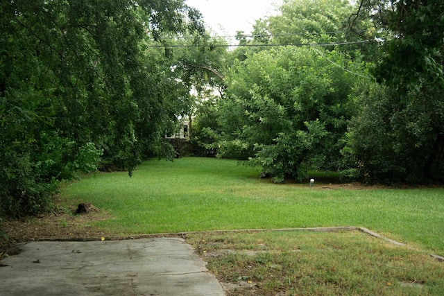 2716 22nd St, Port Arthur, TX 77640 - view of grassy yard featuring a patio