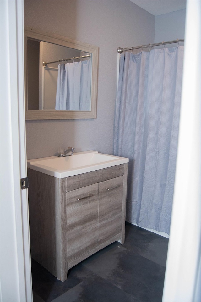 2716 22nd St, Port Arthur, TX 77640 - full bathroom featuring vanity, concrete flooring, and a shower with shower curtain