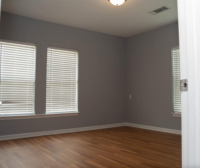2716 22nd St, Port Arthur, TX 77640 - unfurnished room with wood finished floors and baseboards