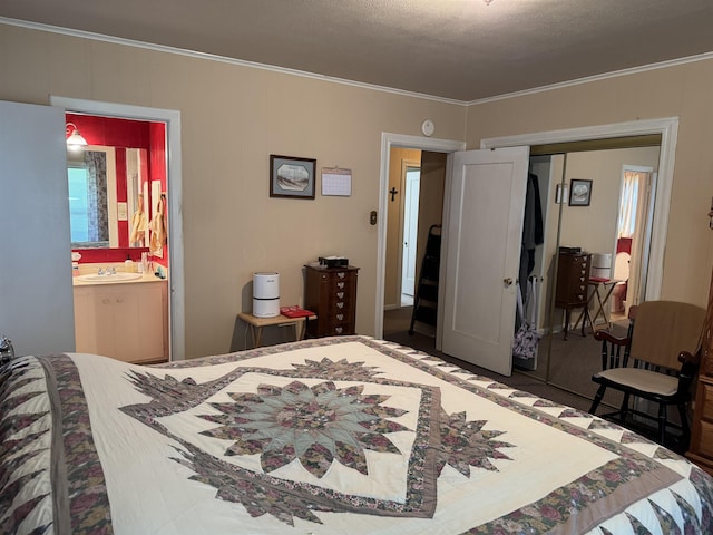 2515 Date St, Port Arthur, TX 77642 - bedroom with a sink, a closet, ornamental molding, and connected bathroom