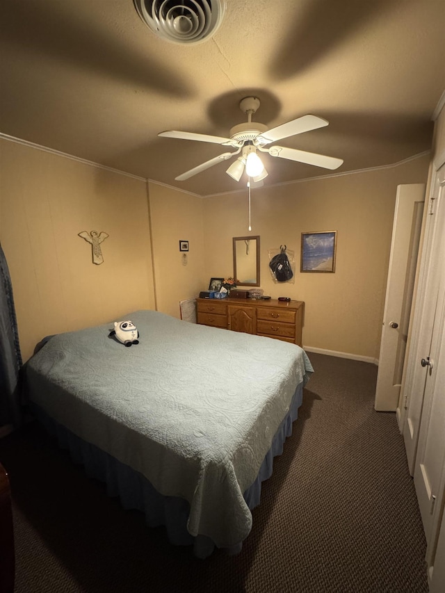 2515 Date St, Port Arthur, TX 77642 - bedroom with dark colored carpet, crown molding, baseboards, and ceiling fan