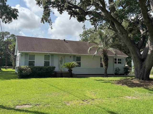 2515 Date St, Port Arthur, TX 77642 - view of front of property with a front yard and roof with shingles
