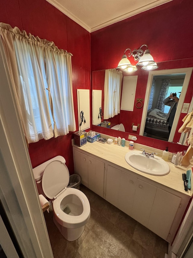 2515 Date St, Port Arthur, TX 77642 - bathroom featuring toilet, vanity, and crown molding