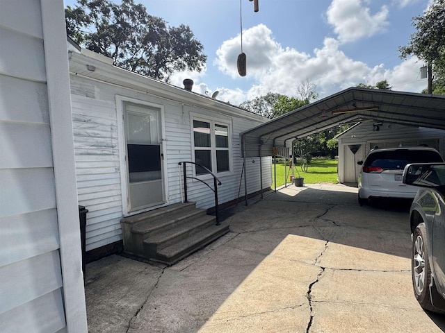 2515 Date St, Port Arthur, TX 77642 - view of patio / terrace featuring entry steps, a detached carport, and driveway