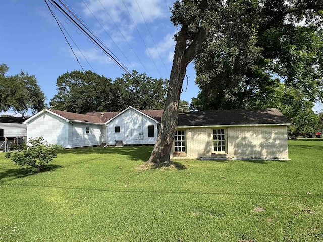 2515 Date St, Port Arthur, TX 77642 - view of front of house with a front lawn and brick siding