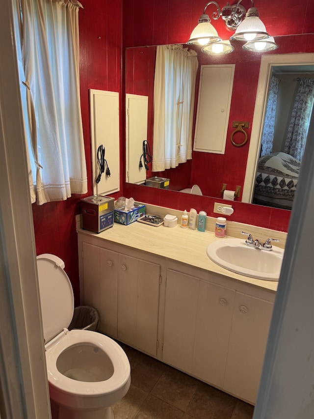 2515 Date St, Port Arthur, TX 77642 - half bathroom with toilet, vanity, and tile patterned flooring