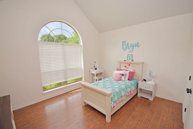 bedroom featuring lofted ceiling and wood-type flooring