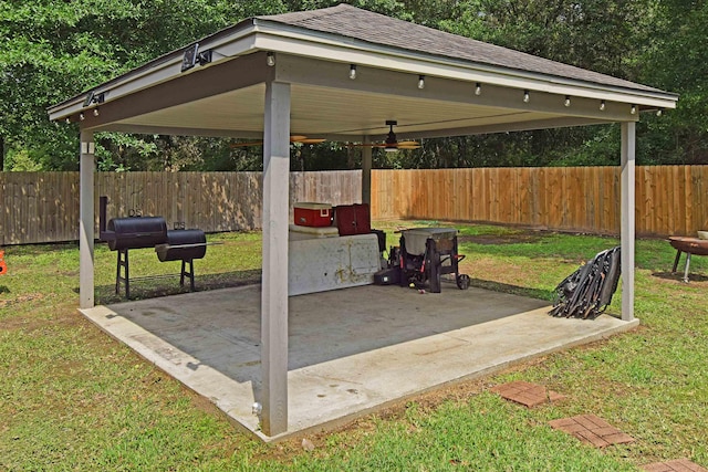 view of patio with area for grilling and ceiling fan