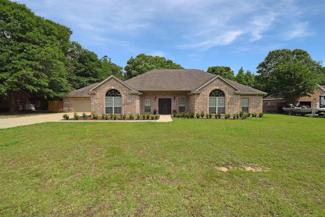 ranch-style home featuring a front yard