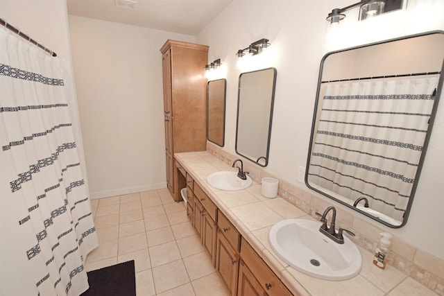 bathroom with tile patterned flooring and vanity