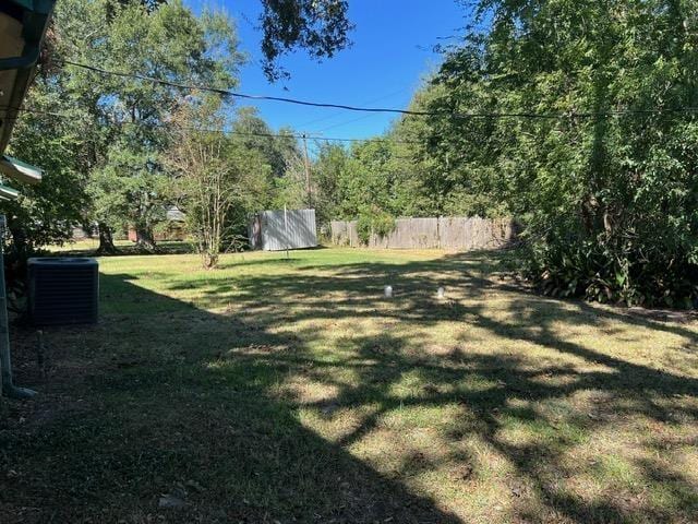 view of yard with central AC