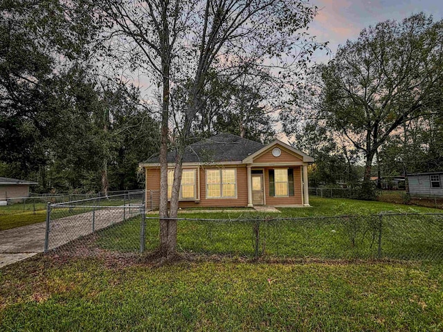 view of front of home with a lawn