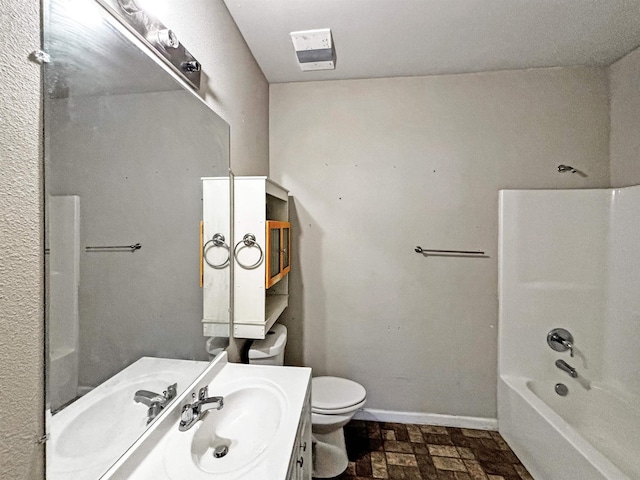 full bathroom with shower / washtub combination, vanity, and toilet