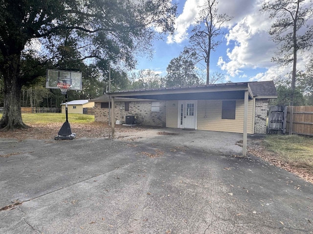 exterior space with a carport and cooling unit