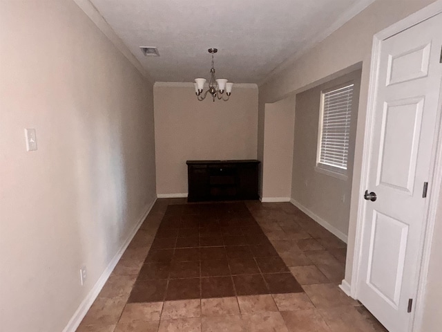 hallway with a chandelier and crown molding