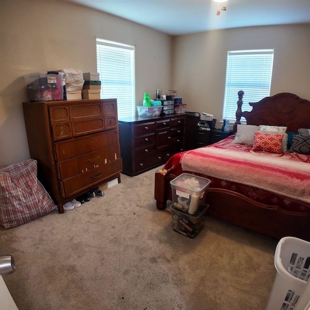 bedroom with light carpet