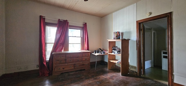 interior space with wooden walls and dark hardwood / wood-style floors