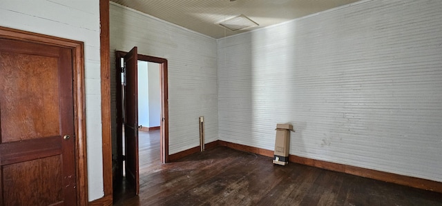 clothes washing area featuring dark hardwood / wood-style flooring