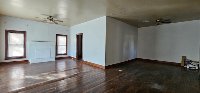 unfurnished room featuring ceiling fan and dark hardwood / wood-style flooring