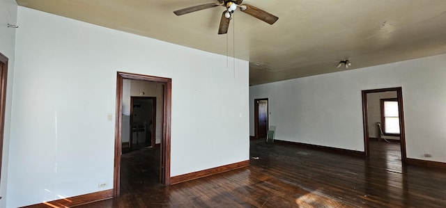 empty room featuring dark hardwood / wood-style flooring and ceiling fan