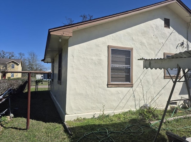301 Morrell Blvd, Orange, TX 77630 - view of home's exterior with stucco siding