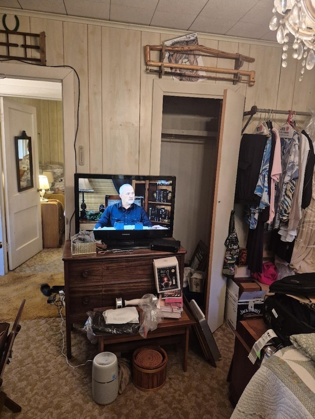 301 Morrell Blvd, Orange, TX 77630 - bedroom featuring carpet flooring, a chandelier, and wood walls