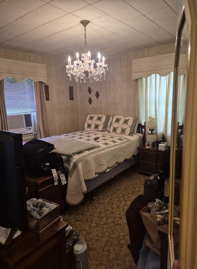 301 Morrell Blvd, Orange, TX 77630 - carpeted bedroom with a chandelier, wood walls, and cooling unit