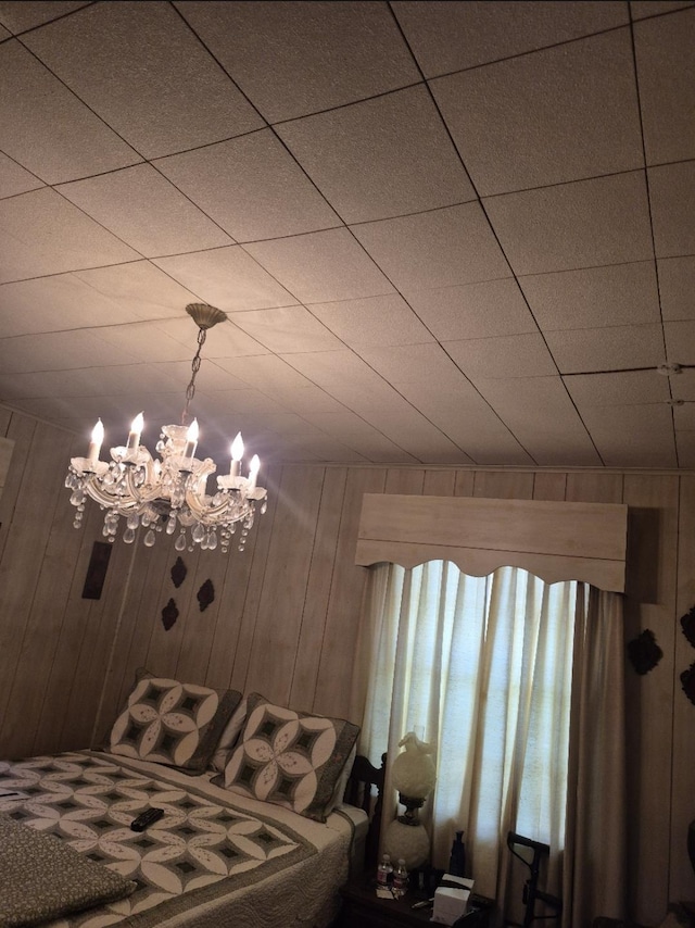 301 Morrell Blvd, Orange, TX 77630 - bedroom with a chandelier and wood walls