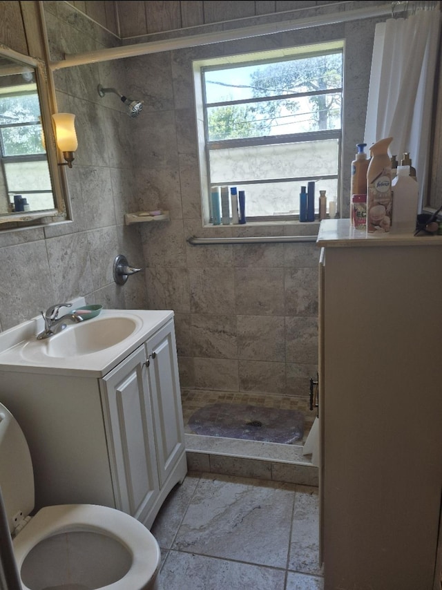 301 Morrell Blvd, Orange, TX 77630 - full bath featuring a tile shower, toilet, and vanity