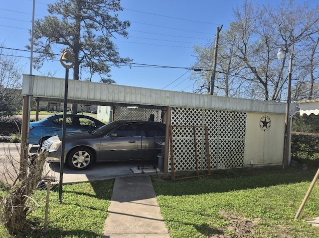 301 Morrell Blvd, Orange, TX 77630 - view of parking featuring a carport