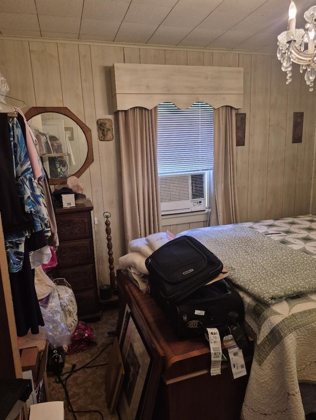 301 Morrell Blvd, Orange, TX 77630 - bedroom with a chandelier, wood walls, and cooling unit
