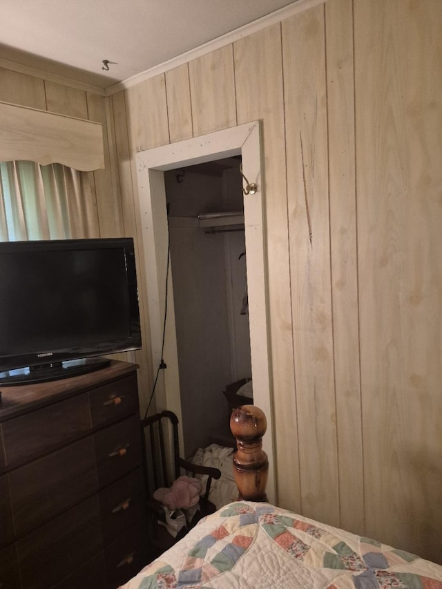301 Morrell Blvd, Orange, TX 77630 - bedroom featuring wooden walls and ornamental molding