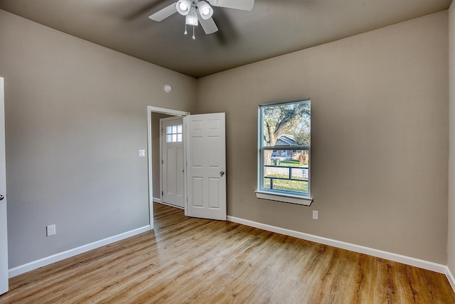 spare room with ceiling fan and light hardwood / wood-style floors